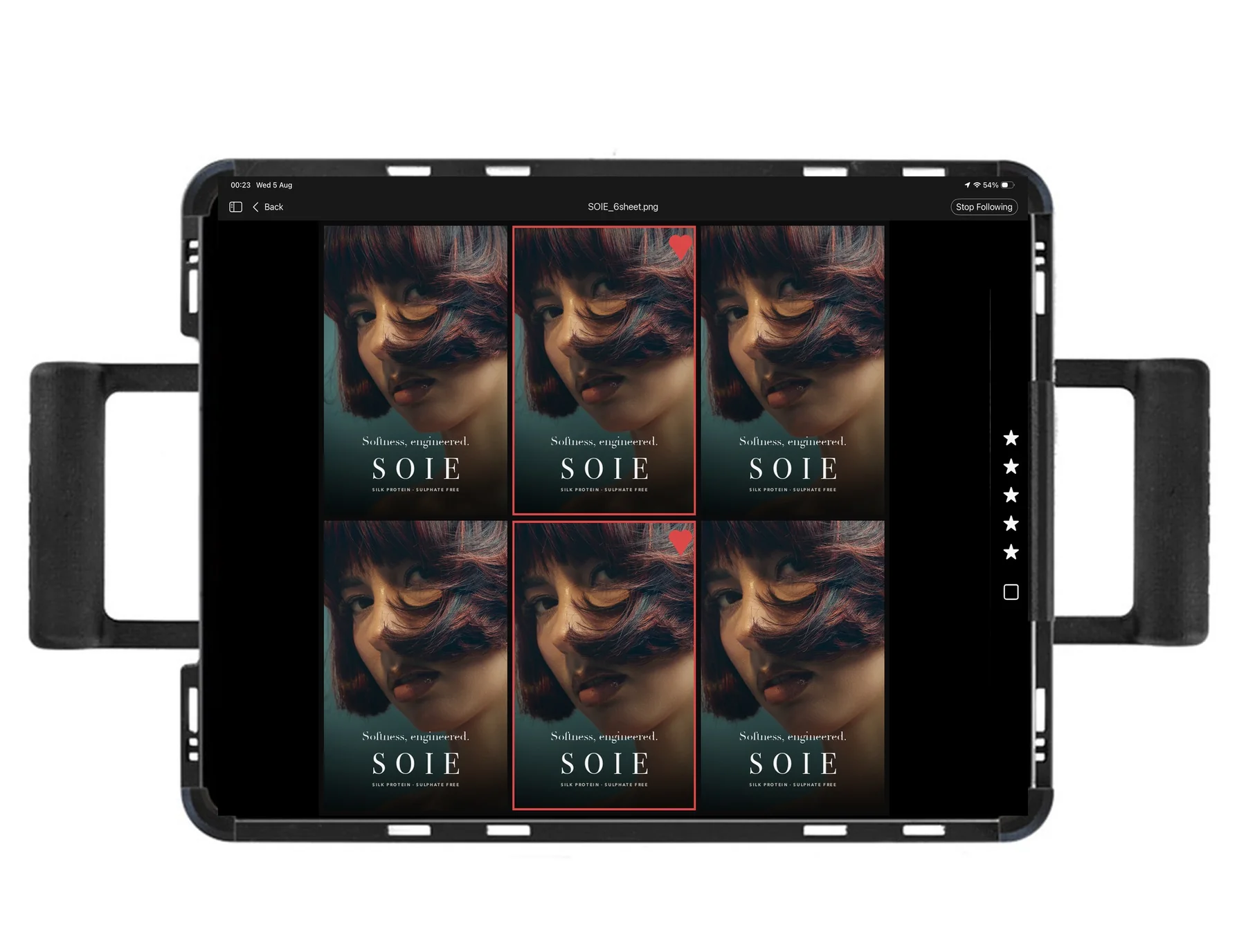 An iPad on set showing a grid of six takes from the setup inside the campaign layout, two marked as selects